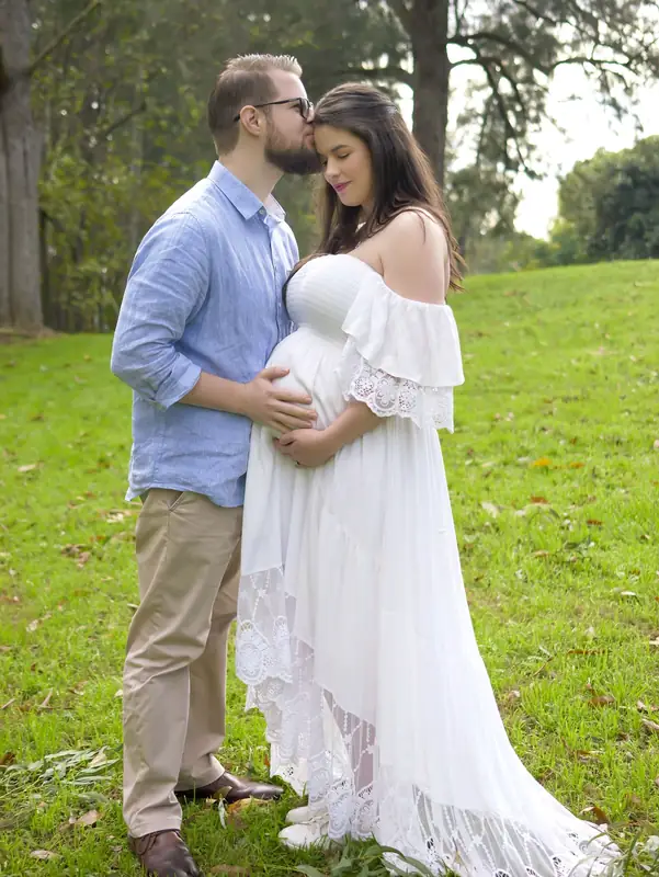 Couple embracing during their pregnancy session