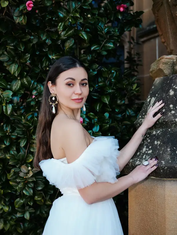 Personal brand portrait outside a sandstone building