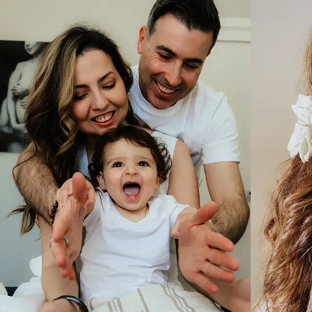 Parents laughing with their baby