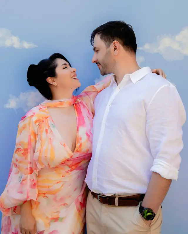 Negin and Alex smiling together during their engagement session