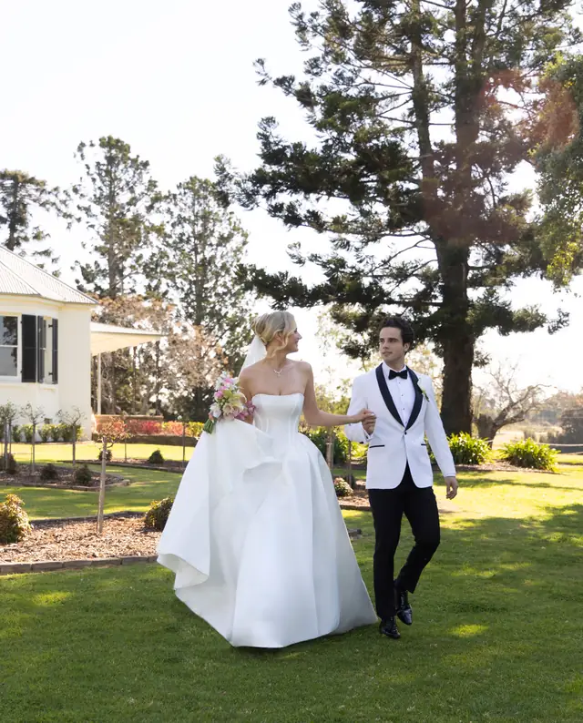Couple celebrating with friends outdoors